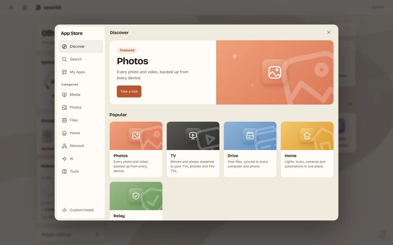 The App Store, Discover page, with a featured Photos banner and popular apps: Photos, TV, Drive and Home.